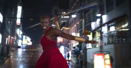 Okoye getting ready to throw her spear towards Klaue